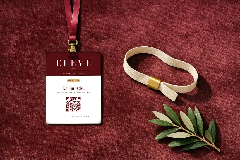 VIP badge & wristband — A burgundy and cream VIP badge with a personal QR for fast check-in and sales follow-up, plus a limestone fabric wristband with a brass slider